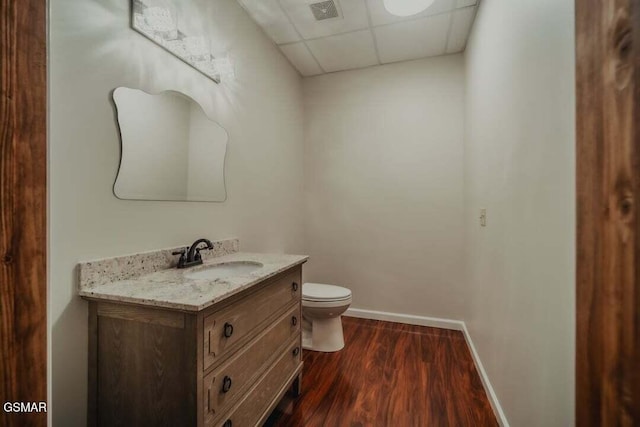 118 Luxury Ln, Dandridge, TN 37725 - bathroom featuring a paneled ceiling, vanity, toilet, baseboards, and wood finished floors