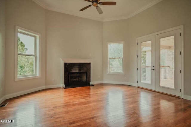118 Luxury Ln, Dandridge, TN 37725 - unfurnished living room with french doors, wood finished floors, a ceiling fan, a fireplace, and baseboards