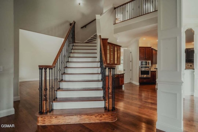 118 Luxury Ln, Dandridge, TN 37725 - stairway featuring wood finished floors, a high ceiling, and baseboards