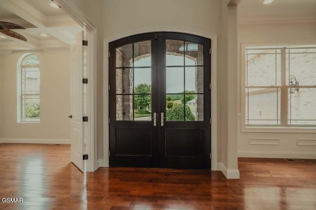 118 Luxury Ln, Dandridge, TN 37725 - entrance foyer with arched walkways, hardwood / wood-style flooring, baseboards, crown molding, and french doors
