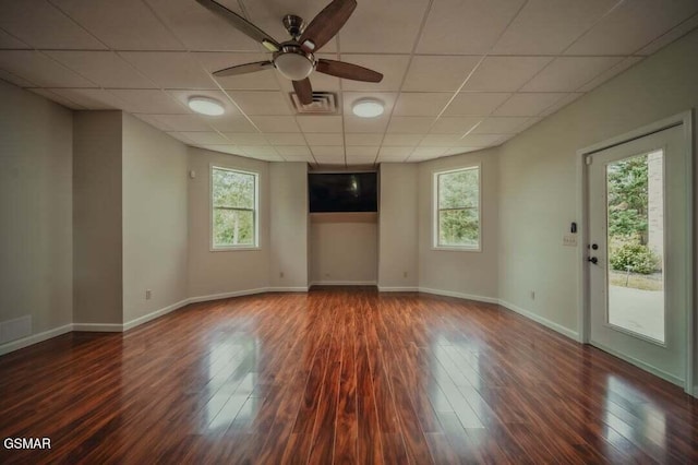 118 Luxury Ln, Dandridge, TN 37725 - unfurnished living room featuring healthy amount of natural light, a ceiling fan, wood finished floors, and a drop ceiling