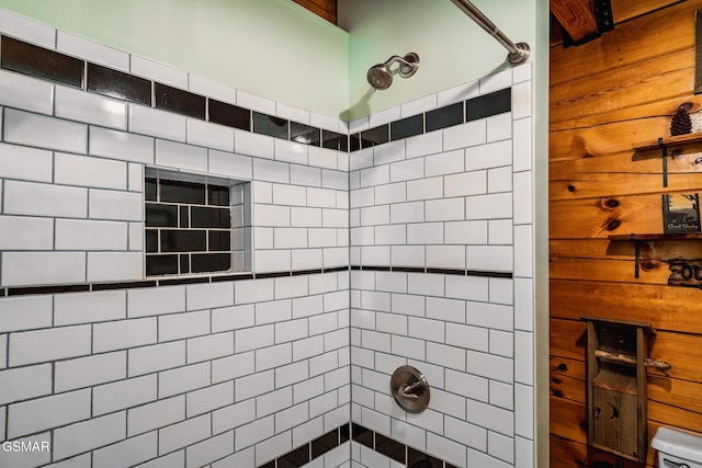 full bath with a tile shower