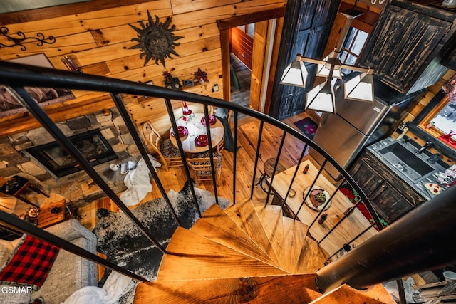 stairs featuring wood walls