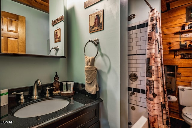 bathroom with toilet, vanity, and shower / bath combination with curtain