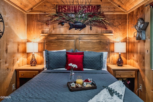 bedroom featuring wooden walls, wooden ceiling, and lofted ceiling