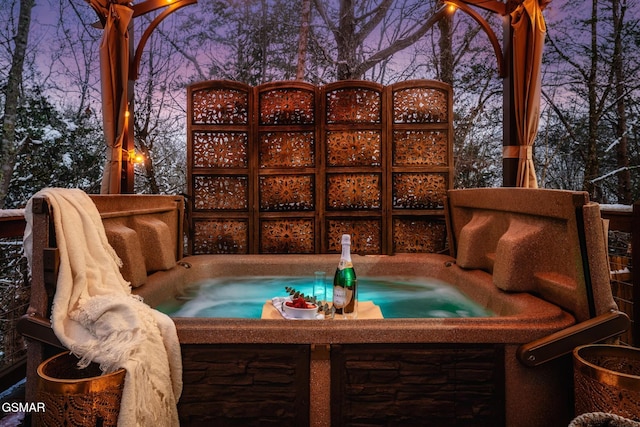exterior space featuring a covered hot tub