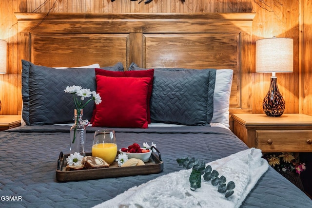 bedroom with wooden walls
