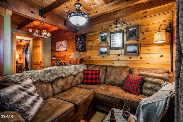living area with beamed ceiling, wooden ceiling, an inviting chandelier, and wood walls