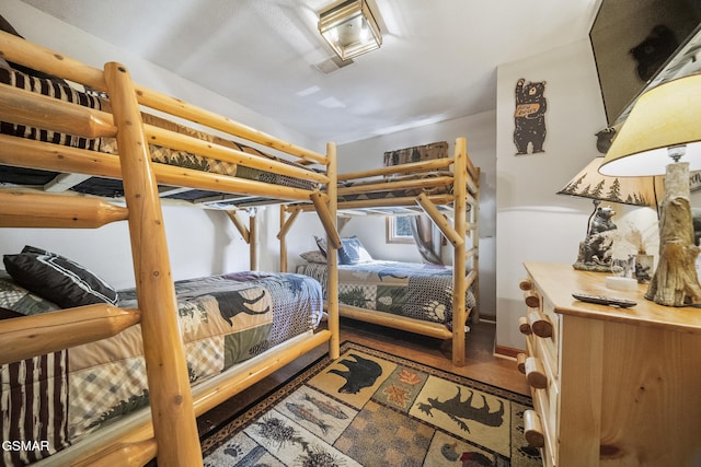 bedroom with wood finished floors