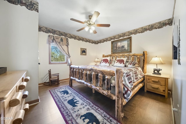 bedroom featuring wood finished floors, baseboards, and ceiling fan