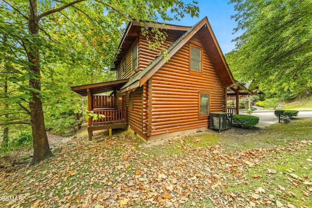 view of side of home featuring cooling unit