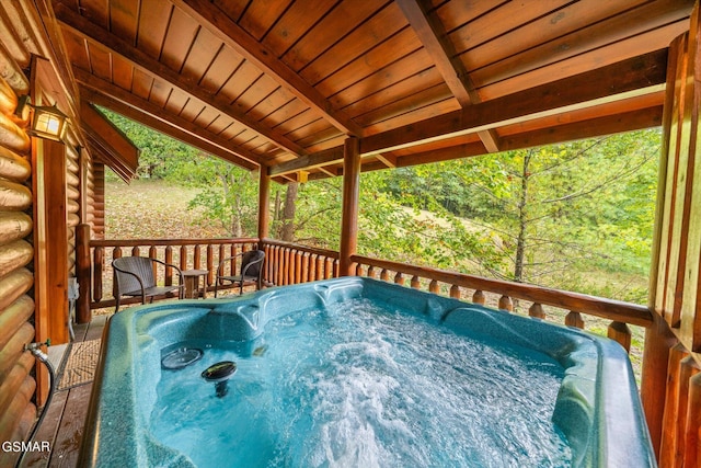 deck featuring a hot tub