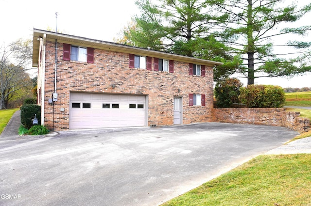 view of side of home featuring a garage