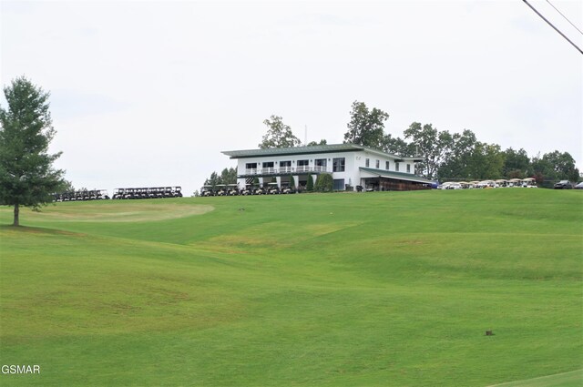 view of home's community featuring a lawn