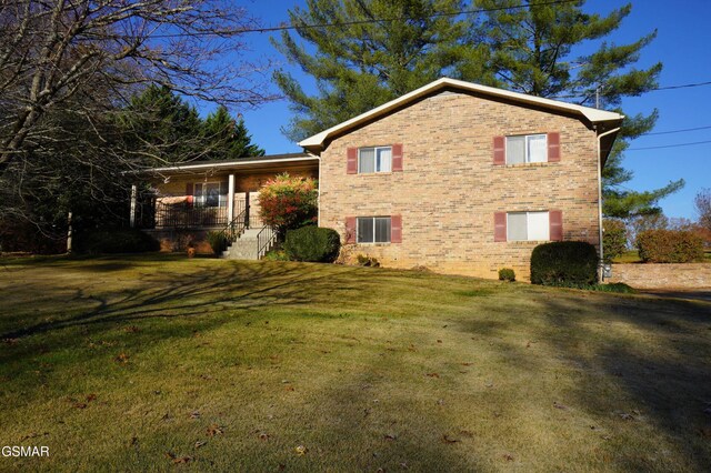 view of property exterior with a yard