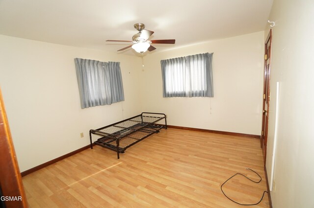 bedroom featuring wood-type flooring and ceiling fan