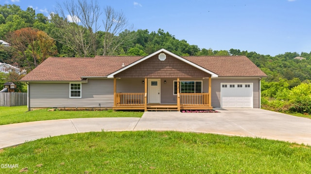 412 Apple Valley Rd, Sevierville, TN 37862 - ranch-style house with concrete driveway, a porch, an attached garage, and roof with shingles