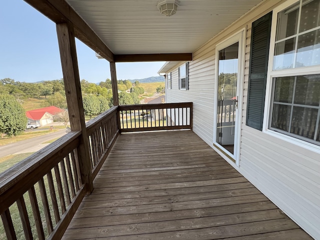 wooden deck featuring a mountain view