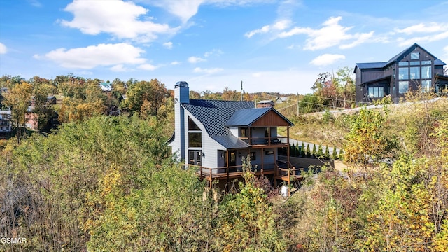 rear view of property with a deck