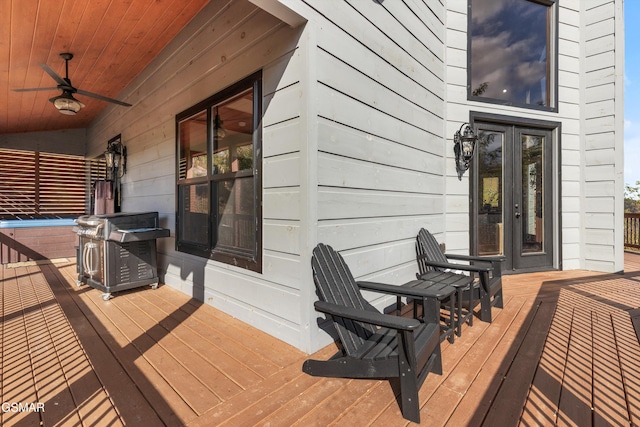 wooden terrace with french doors and ceiling fan