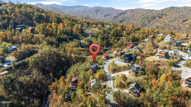 drone / aerial view featuring a mountain view