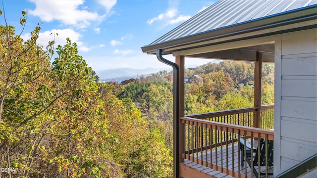 wooden deck with a mountain view