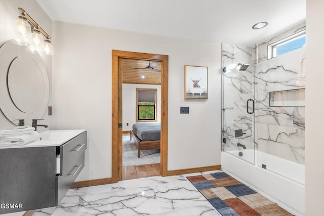 bathroom with vanity and enclosed tub / shower combo