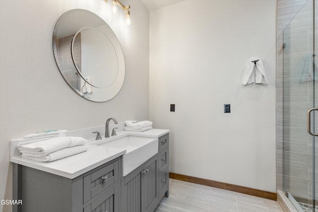 bathroom with tile patterned flooring, vanity, and an enclosed shower