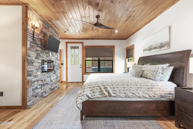 bedroom featuring light hardwood / wood-style flooring and wood ceiling