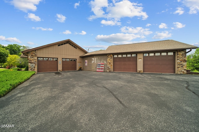 1505 Canterbury Ln, Sevierville, TN 37862 - view of front of house featuring stone siding, board and batten siding, and roof with shingles