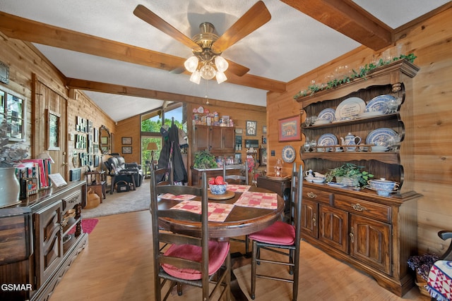 1505 Canterbury Ln, Sevierville, TN 37862 - dining space with a ceiling fan, wooden walls, and light wood-type flooring