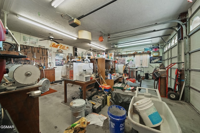 1505 Canterbury Ln, Sevierville, TN 37862 - garage featuring a garage door opener, a workshop area, and ceiling fan