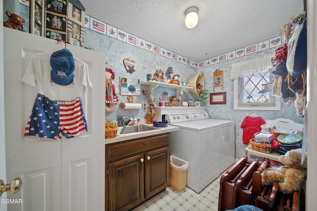 1505 Canterbury Ln, Sevierville, TN 37862 - laundry room with independent washer and dryer, a textured ceiling, cabinet space, wallpapered walls, and light flooring
