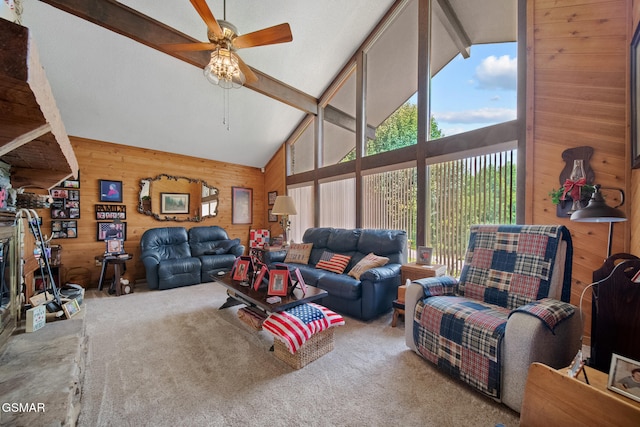 1505 Canterbury Ln, Sevierville, TN 37862 - carpeted living area featuring wood walls, beam ceiling, a ceiling fan, and high vaulted ceiling