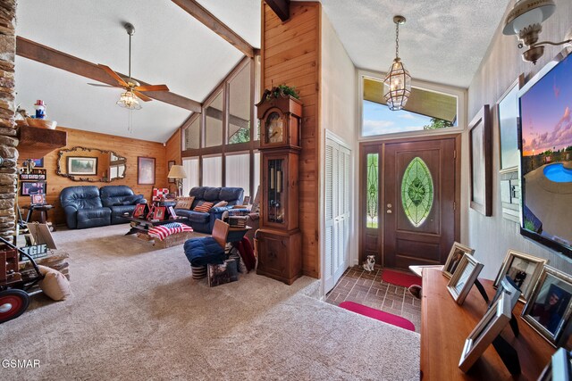 1505 Canterbury Ln, Sevierville, TN 37862 - foyer entrance featuring plenty of natural light, a ceiling fan, carpet flooring, brick patterned floors, and high vaulted ceiling