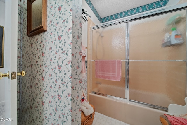 1505 Canterbury Ln, Sevierville, TN 37862 - bathroom featuring shower / bath combination with glass door and a textured ceiling