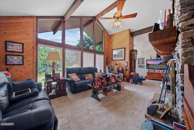 1505 Canterbury Ln, Sevierville, TN 37862 - carpeted living room with wooden walls, high vaulted ceiling, beamed ceiling, and a ceiling fan