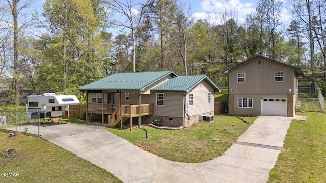 view of front of property featuring a garage, a front lawn, driveway, and crawl space