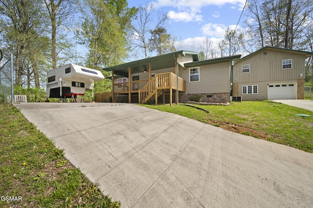 view of front of house featuring an attached garage, crawl space, a front yard, concrete driveway, and covered porch