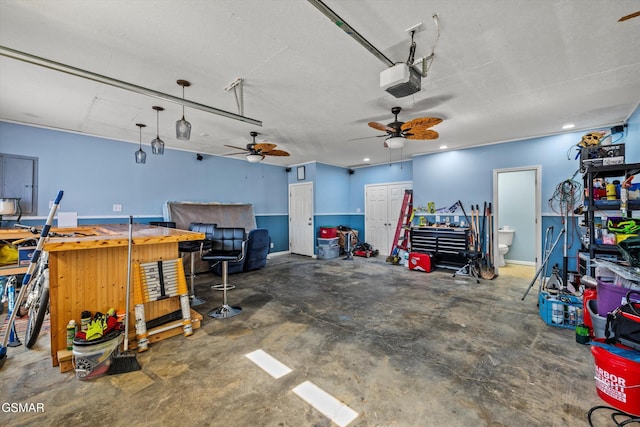 garage with recessed lighting, a garage door opener, and a ceiling fan