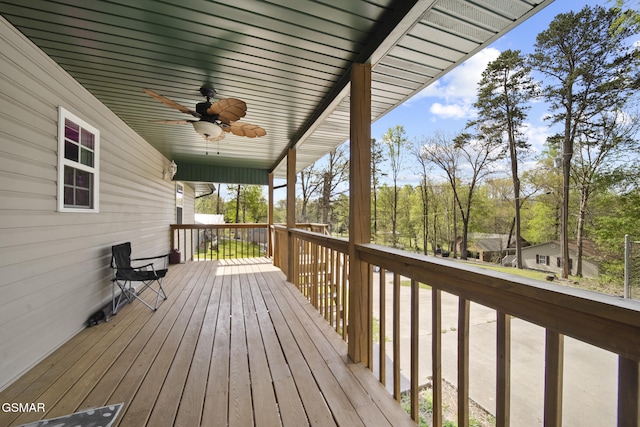 wooden terrace featuring ceiling fan