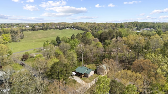 birds eye view of property with a wooded view