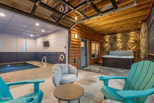 view of patio / terrace with an indoor hot tub