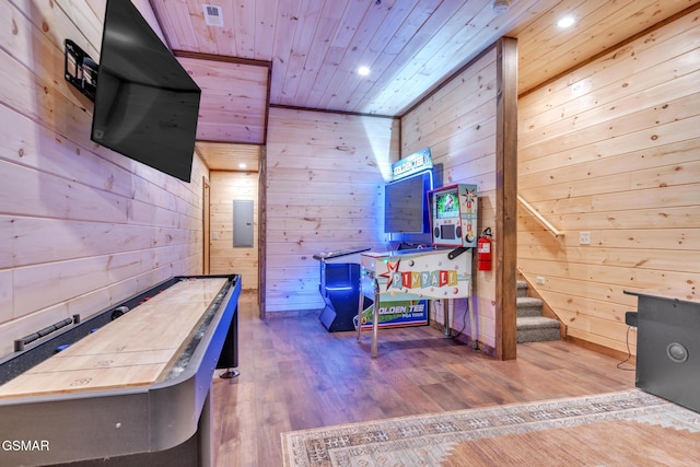 recreation room with wooden ceiling, recessed lighting, wood finished floors, and wood walls