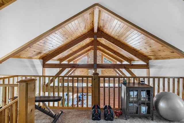 interior space with beamed ceiling, carpet floors, and wood ceiling