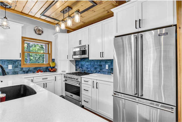 kitchen with tasteful backsplash, premium appliances, pendant lighting, wooden ceiling, and white cabinets