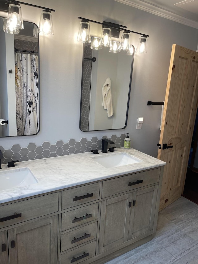 bathroom with vanity, wood-type flooring, decorative backsplash, and crown molding