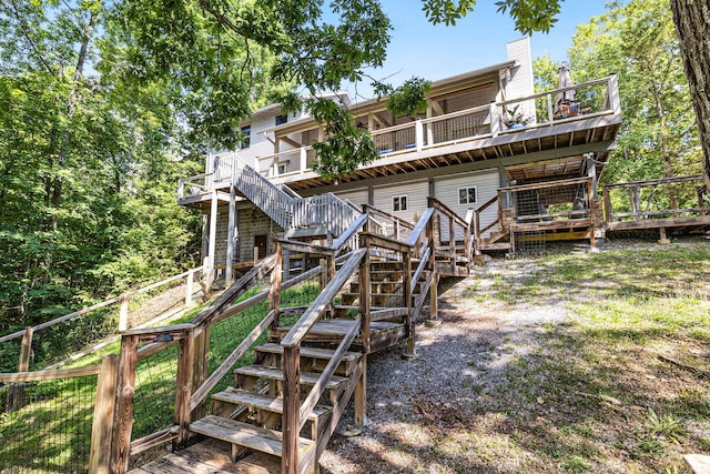 rear view of house with a wooden deck