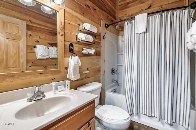 full bathroom featuring wood walls, toilet, shower / tub combo, and vanity