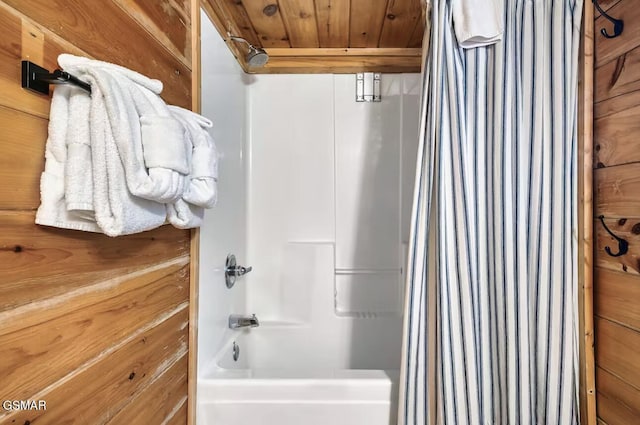 bathroom with shower / bath combo with shower curtain